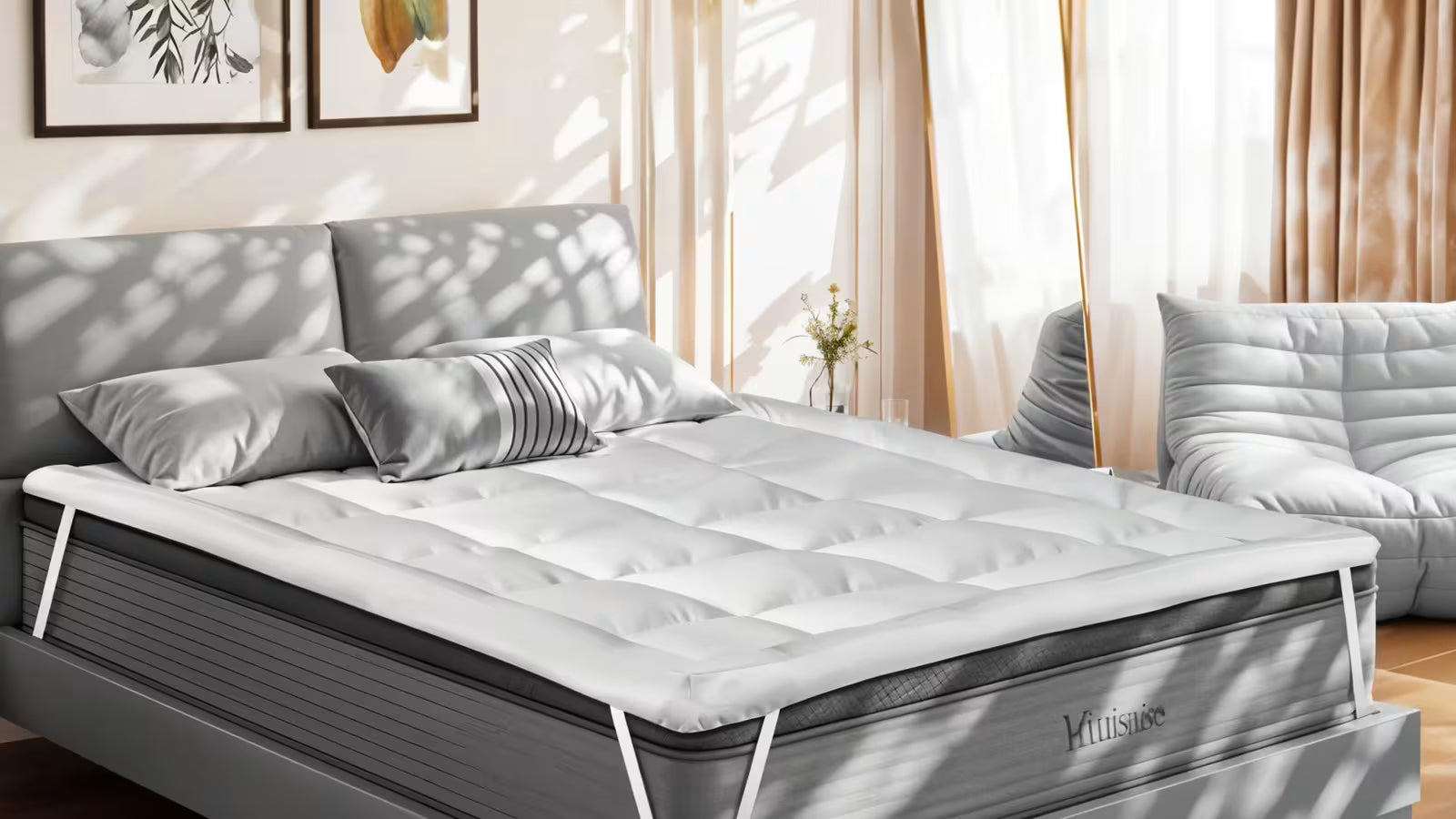 a bed with a secure fit mattress topper is placed in a lit room