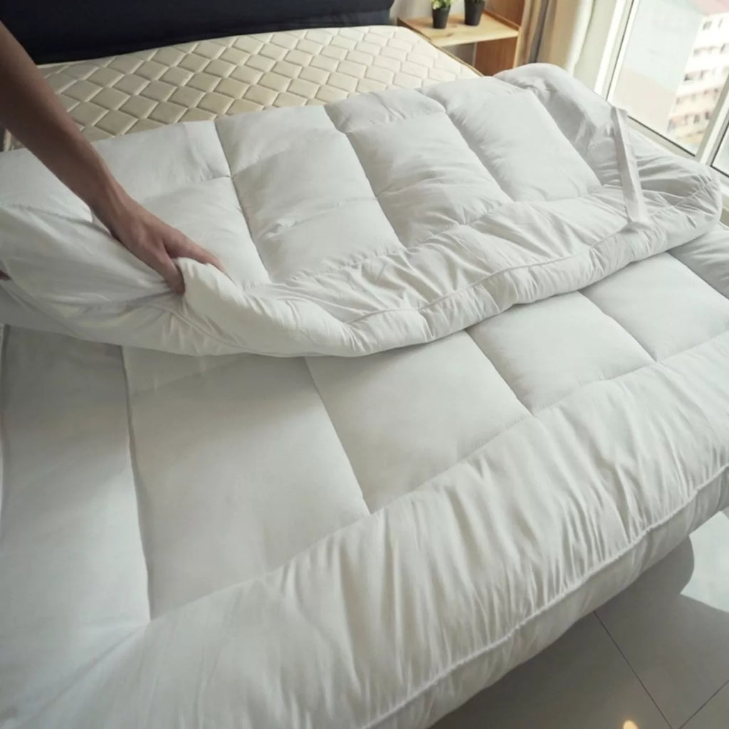 Close-up of breathable and ultrasoft quilted fabric on a king size mattress topper.
